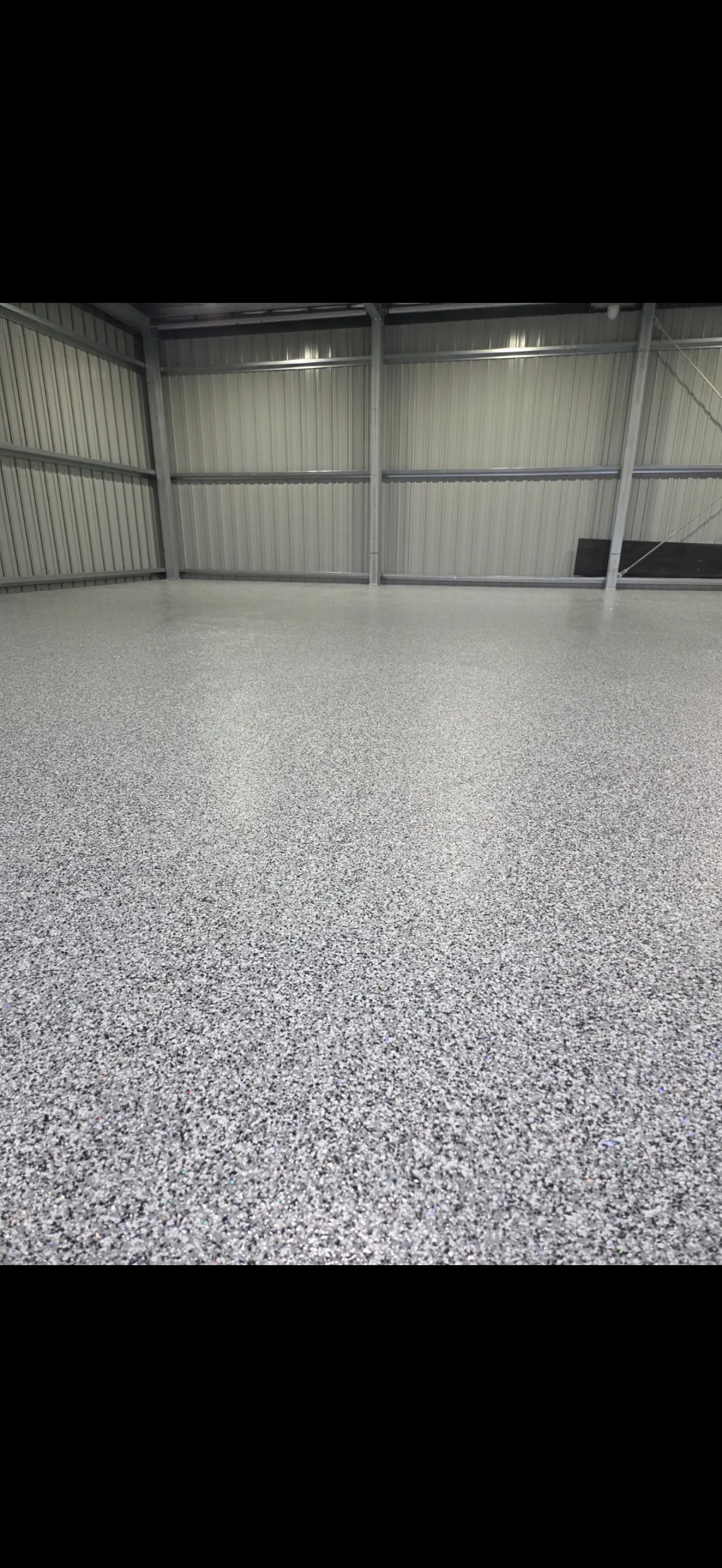 Grey flake epoxy floor in a large warehouse